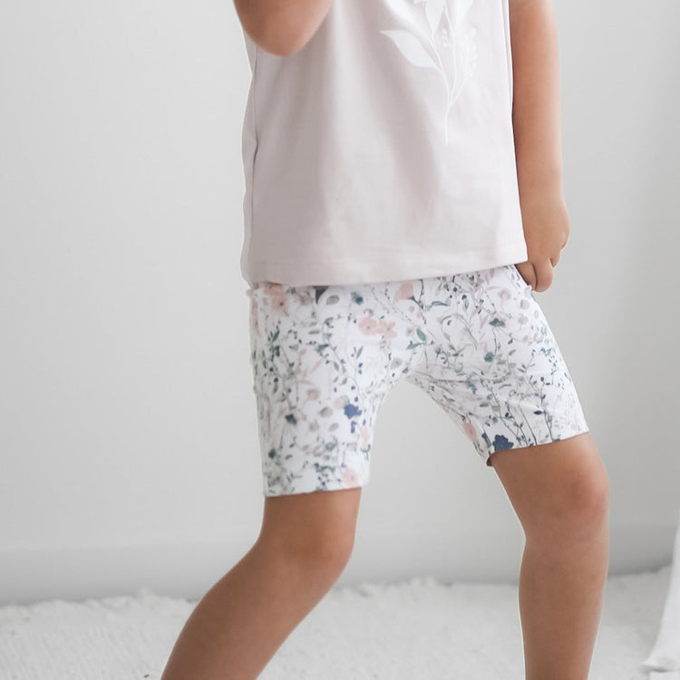 Child wearing Wildflower/Lavender Penny Shorts and T-shirts from Burrow and Be