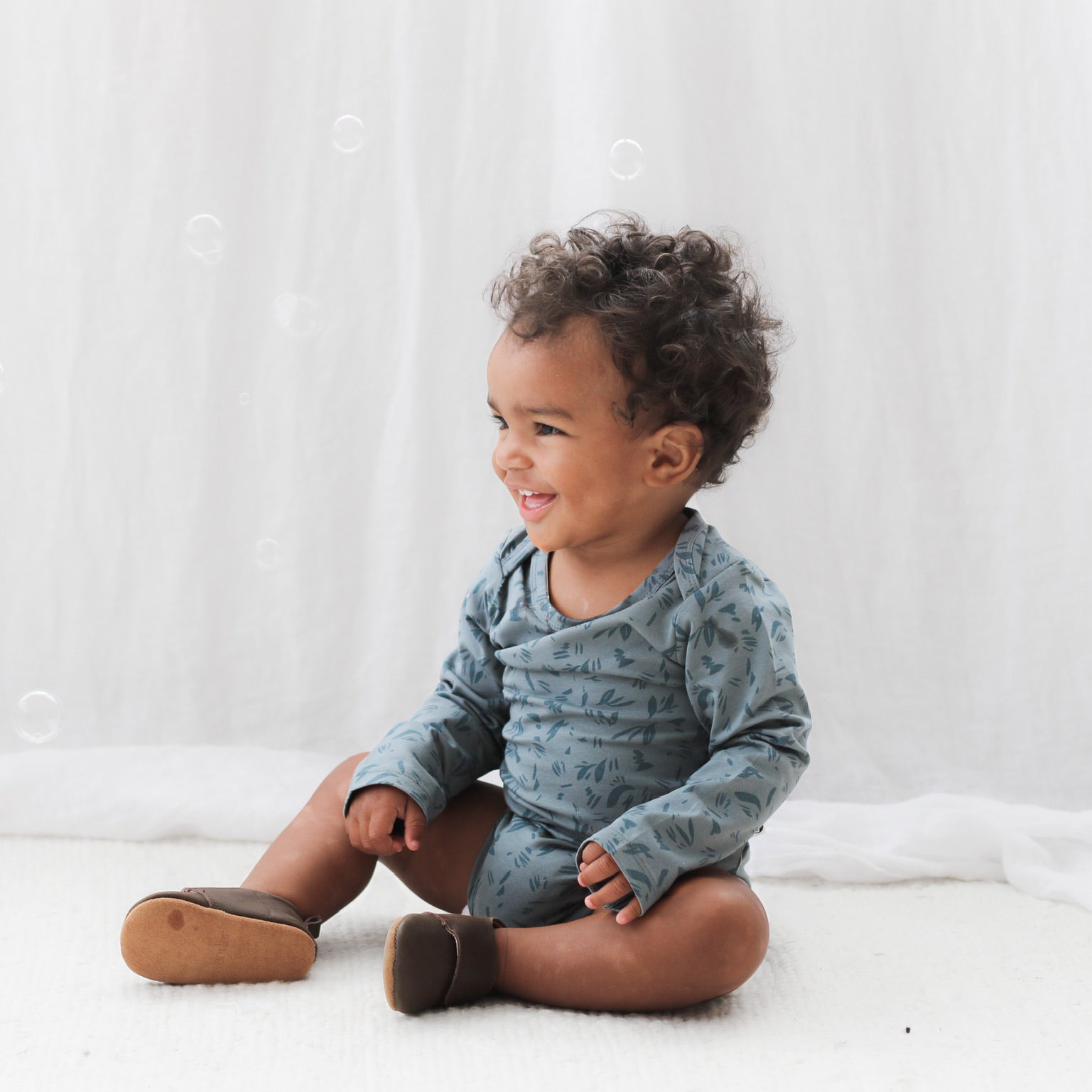 Toddler wearing Burrow and Be Marks Long Sleeve Bodysuit and Wanders shoes