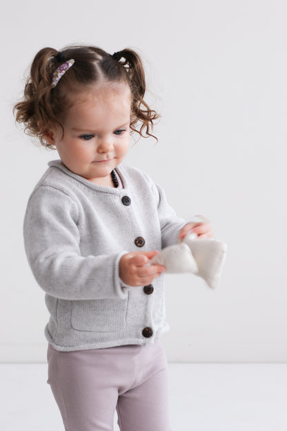 Girl standing against white background in Lavender Cardigan and Essential Derby Rib Leggings - Lavender by Burrow and Be