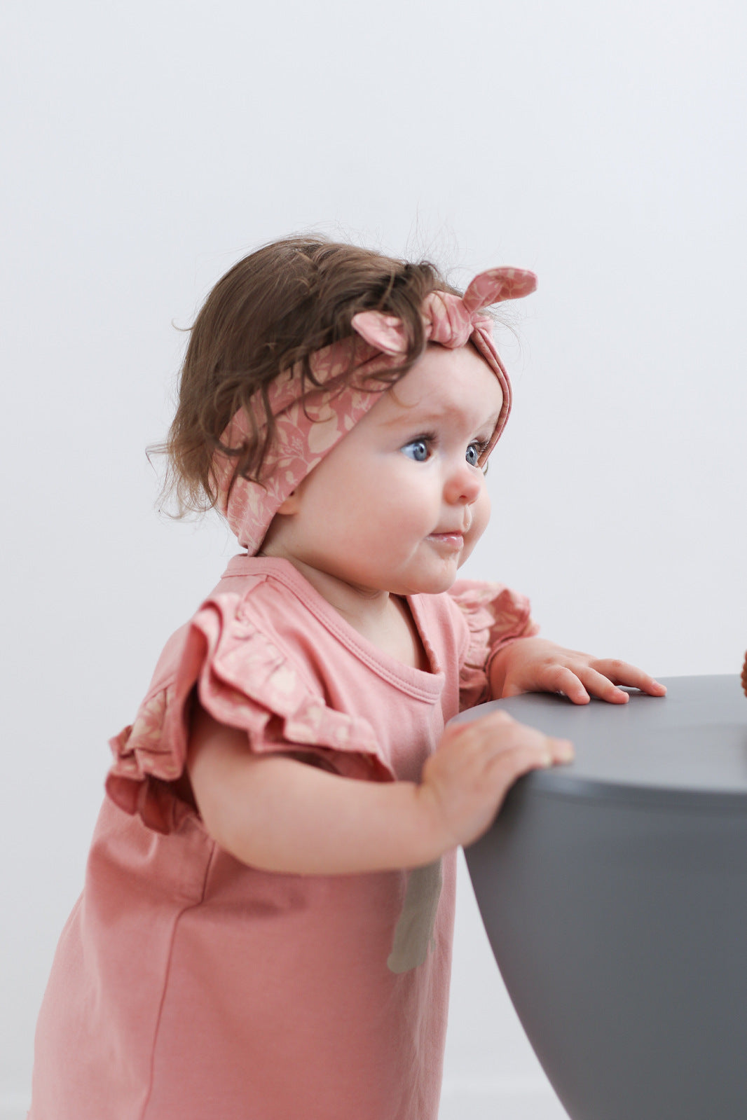 Baby girl wearing Doe Flutter T-shirt and Essential Baby Headband in Mead-Doe print, designed by Burrow and Be